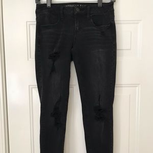 Faded black ripped denim skinny jeans